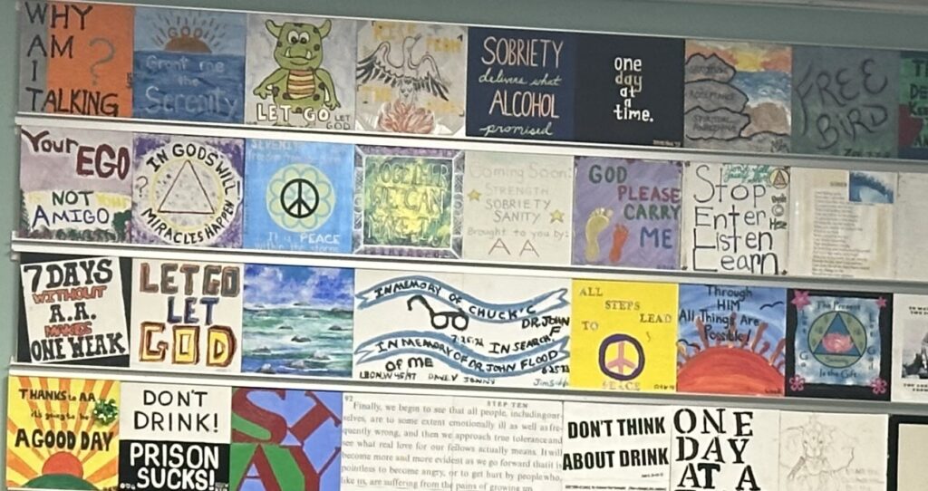 Members decorate bricks with AA slogans which are placed on the wall of the Club.